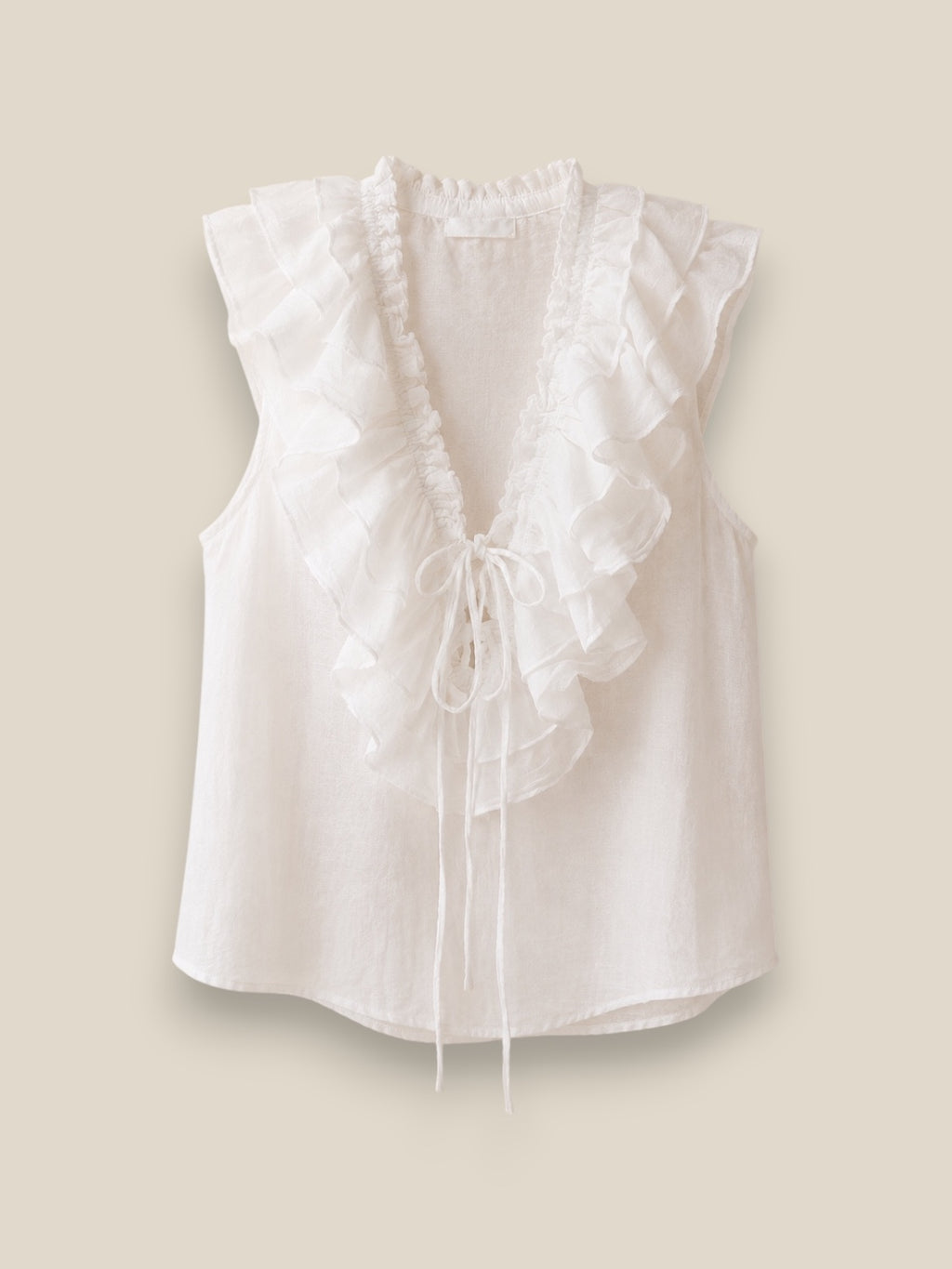 Blusa Roma blanca sin mangas con volantes en escote V y lazo de cinta en 100% algodón
