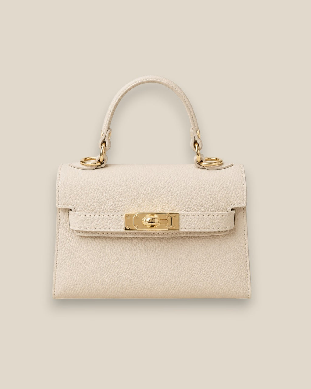 Bolso Kelly Crema de piel estructurado con asa corta y detalles metálicos dorados, vista frontal