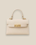 Bolso Kelly Crema de piel estructurado con asa corta y detalles metálicos dorados, vista frontal