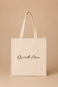 Bolso de tela con el logo Quiérete Muxo