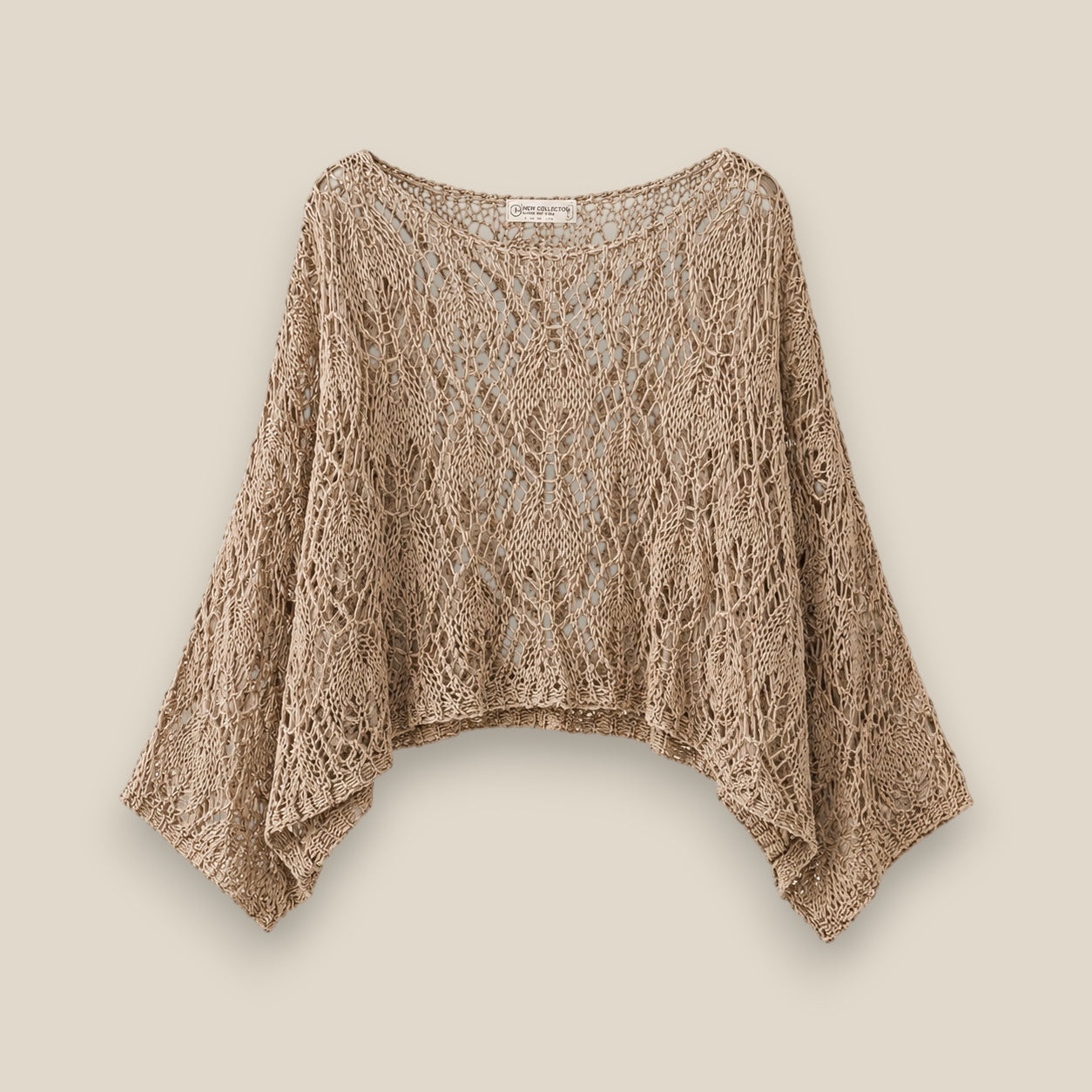 Jersey de punto calado oversize en tono beige con hombro caído — estilo boho y femenino