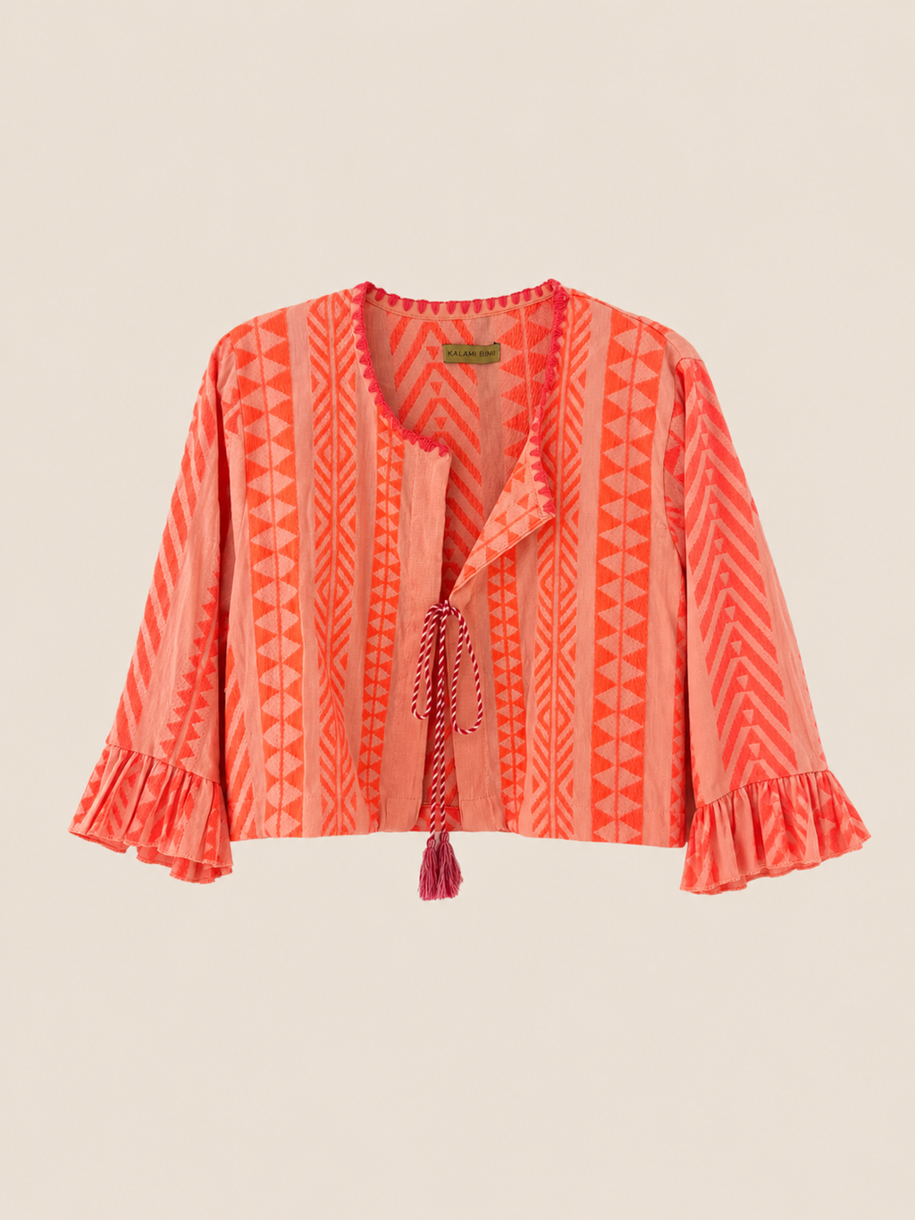La chaquetita Kalami es una pieza única, realizada artesanalmente en algodón 100% procedente de la India naranja